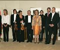 Su Majestad y Sus Altezas Reales, con la ministra de Sanidad y Consumo y el director y solistas de la Orquesta