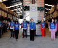 Su Majestad la Reina Doña Sofía junto a un grupo de voluntarios