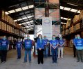 Su Majestad la Reina Doña Sofía junto a un grupo de voluntarios